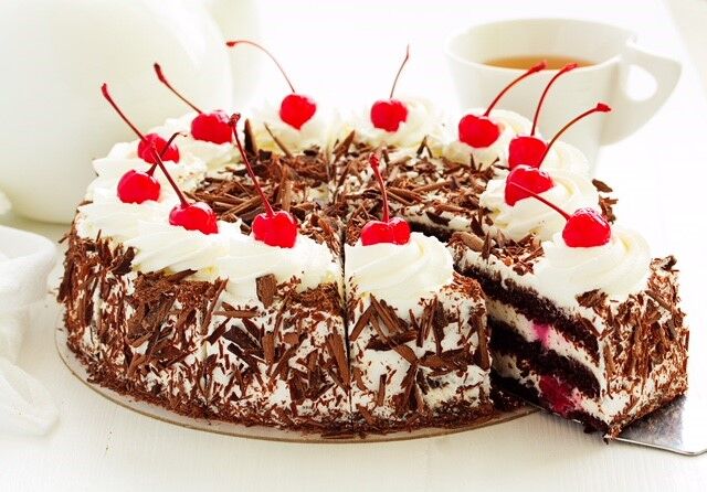 Black Forest Cake reflects the red pompoms on a Bollehut costume.